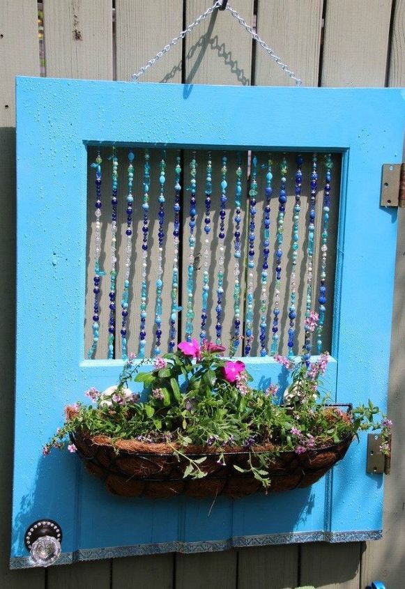 15 brilliant ways to upcycle old doors, Transform it into a colorful hanging planter