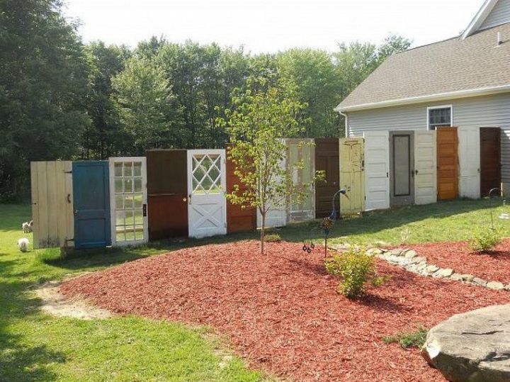 15 brilliant ways to upcycle old doors, Stack them side by side for an eclectic fence