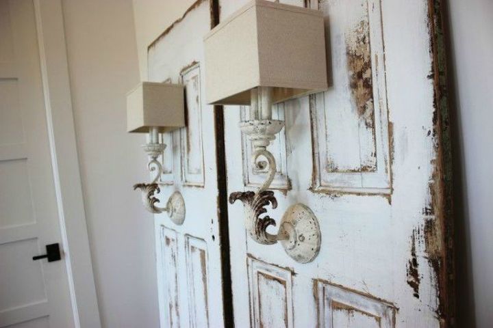 15 brilliant ways to upcycle old doors, Use them to hold antique sconces