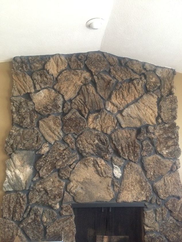 mantel on rock fireplace