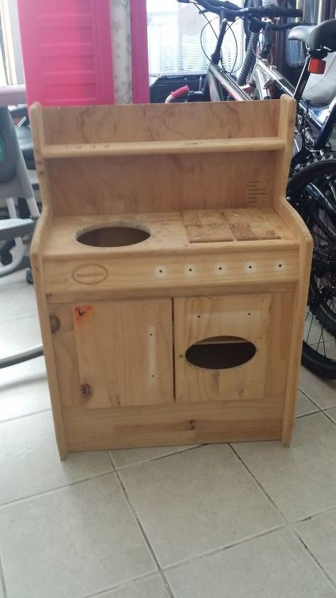 q does anyone have any ideas for this children kitchenette set , crafts, repurpose unique pieces, repurposing upcycling, I m not sure what to do with the hole in the top that had a metal bowl for the sink Also what to do with the hole in the cabinet door