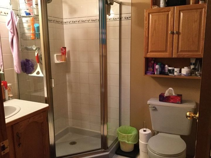 q how hard is it to re configure a small bathroom , bathroom ideas, tiling, There is a bit of room between the vanity and shower and a bit more between the shower and toilet Can the door be changed to open out of the bathroom to give us more room