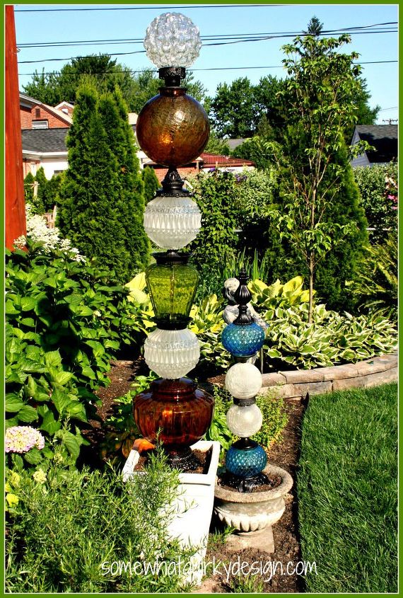 why everyone is loving these cheap glass globes, They can be stacked up into garden totems
