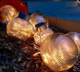 why everyone is loving these cheap glass globes, They look whimsical filled with fairy lights