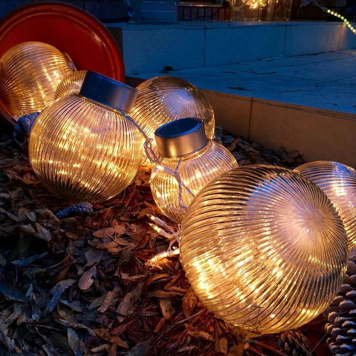 why everyone is loving these cheap glass globes, They look whimsical filled with fairy lights