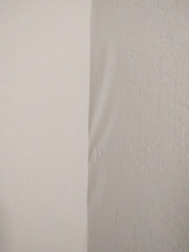 paint separating from the wall