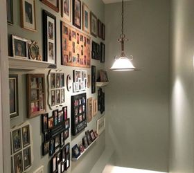 if your stairway walls are empty here s what you re missing, A big gallery wall of family pictures