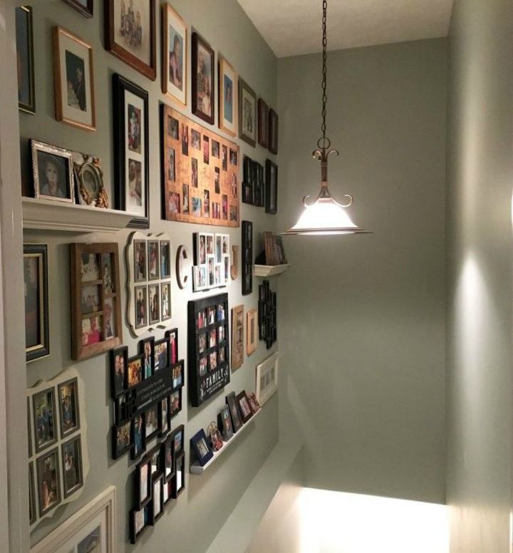 if your stairway walls are empty here s what you re missing, A big gallery wall of family pictures