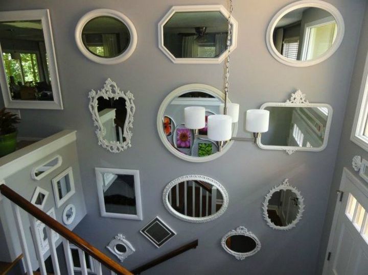 if your stairway walls are empty here s what you re missing, A gallery of different shaped mirrors
