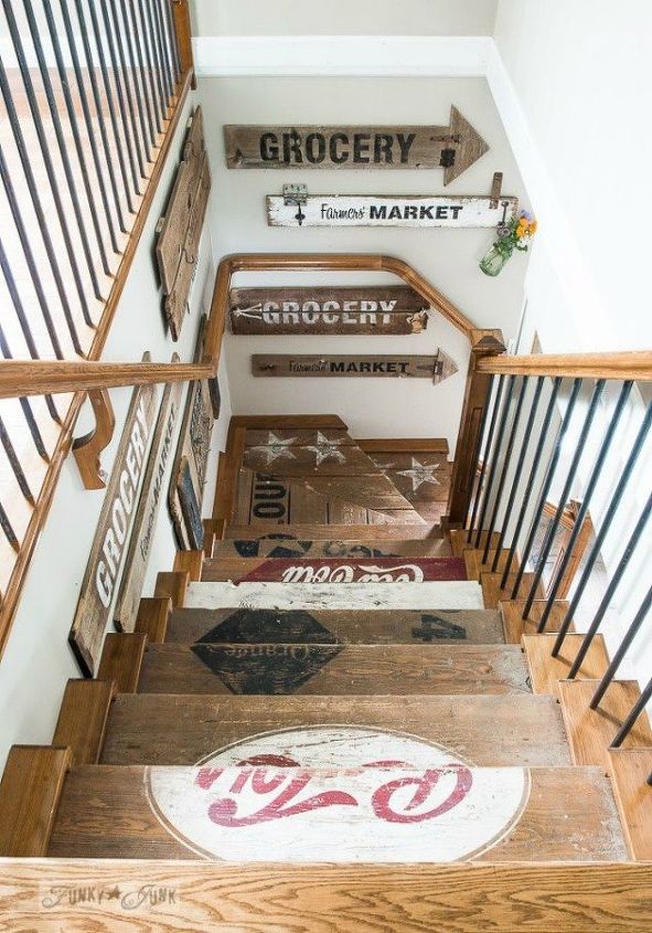 if your stairway walls are empty here s what you re missing, A collection of rustic painted signs