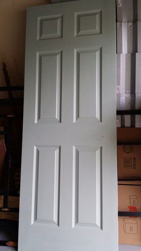 old door transformed to hall tree coat rack