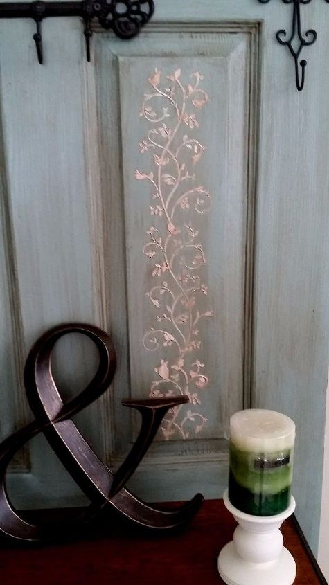 old door transformed to hall tree coat rack
