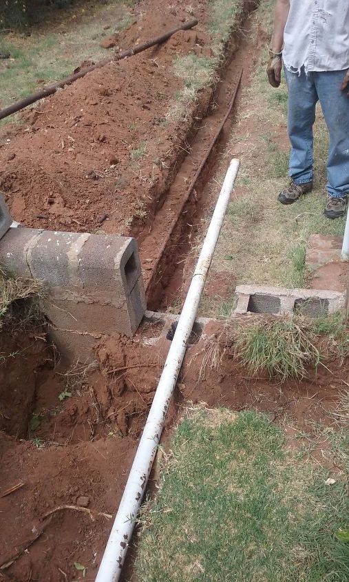 don t cut the concrete slab drill a tunnel under it instead, We had to remove blockes from retaining wall