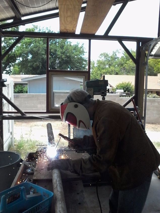 don t cut the concrete slab drill a tunnel under it instead, welding the extension to the 9 foot pipe