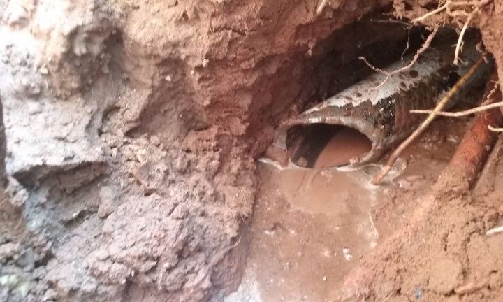 don t cut the concrete slab drill a tunnel under it instead, The cutting end breaks through