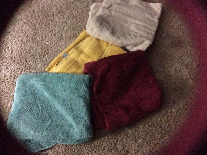 q how can i recycle over supply of good towels , repurpose household items, repurposing upcycling, These are just some of the many thick towels stuffed into the shelves
