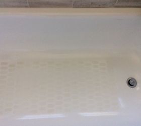 cleaning the permanent slip guard dots in my porcelain bathtub, As you can see the rest of tub is shiny but I have scrubbed the dots cannot get them pure white again
