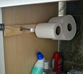 s 11 space saving hacks for your tiny bathroom, bathroom ideas, Stick on some door stoppers for toilet paper