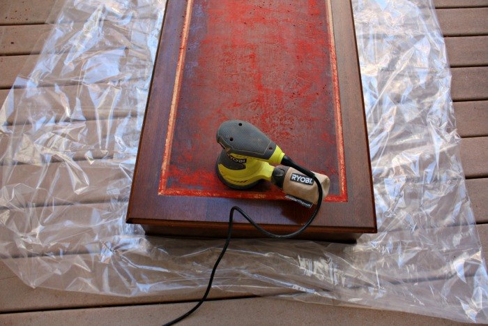 removing damaged leather from a desk, painted furniture