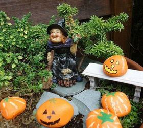 make your neighbors giggle with these 9 halloween fairy garden ideas, Paint pebbles and rocks as pumpkins