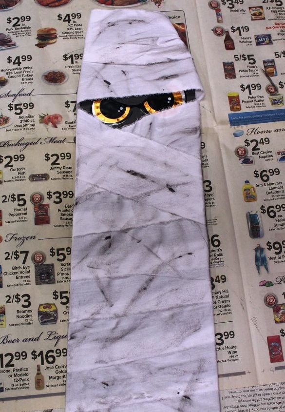 make a halloween mummy from a ceiling fan blade, halloween decorations, repurposing upcycling, seasonal holiday decor, wall decor, Dry brush paint on for a dirty look