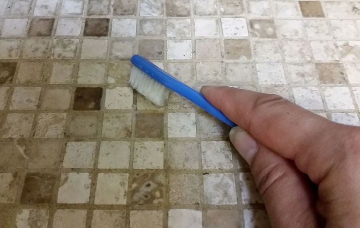 easy grout cleaner and swiffer hack for under 8, Almost Done Let s Use the Toothbrush Next