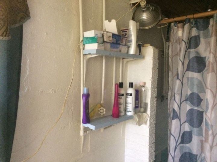 q i m drawing a blank on ideas of what i can do with this ugly thing , shelving ideas, Shelf by shower All walls are block with pipes on the walls showing which are in use