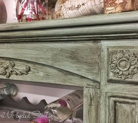 fireplace is beautifully upcycled into an aged wine rack, fireplaces mantels