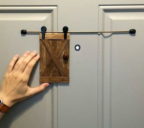 s 10 easy ways to fix your old door in under an hour, doors, Add a mini sliding barn door peephole cover