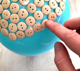 You place a button on a full balloon. When it pops? Adorable gift idea