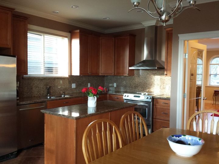 how to remove a 18 high granite kitchen backsplash, This is the before photo of the kitchen We are gutting the entire room and replacing these cabinets with a more traditional raised panel cream cabinet doors to the ceiling and a charcoal stained island