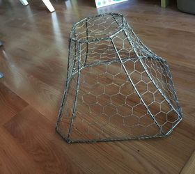 new life for a busted lamp shade with chicken wire