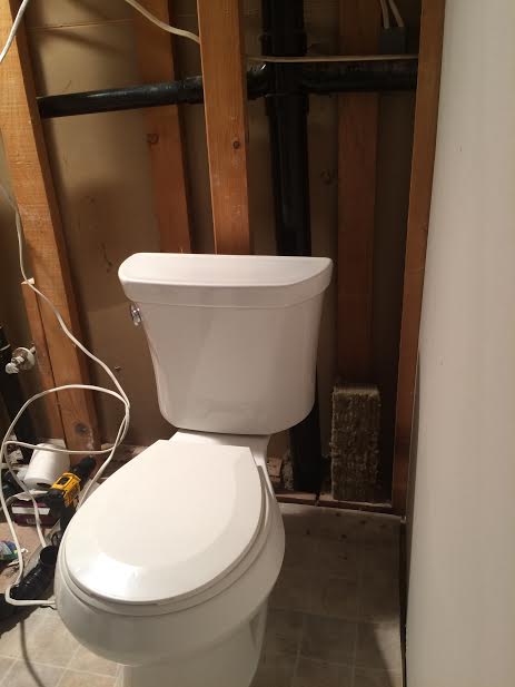 a family affair father in law helps couple mg equip their bathroom, bathroom ideas, Inside the wall behind Kohler toilet