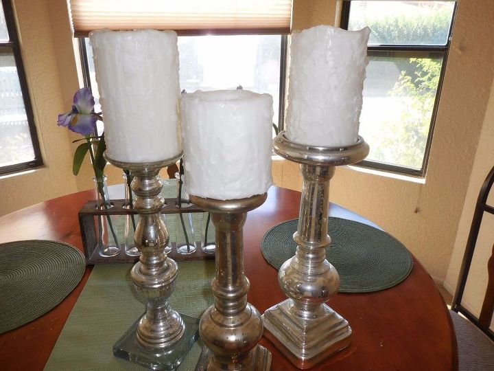 s 15 simple candle transformations you need to try this season, Add elegance by dripping wax down their sides