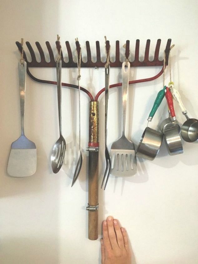 13 storage ideas that will instantly declutter your kitchen drawers, Repurpose an old rake for your baking goods