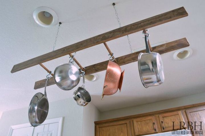13 storage ideas that will instantly declutter your kitchen drawers, Use a ladder to hang your pots and pans