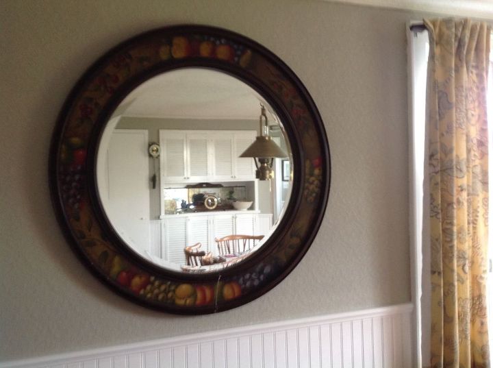 q mirror need some to be redone , home decor, home improvement, The painting surrounding the mirror is of aged looking fruit Need it to be brighter