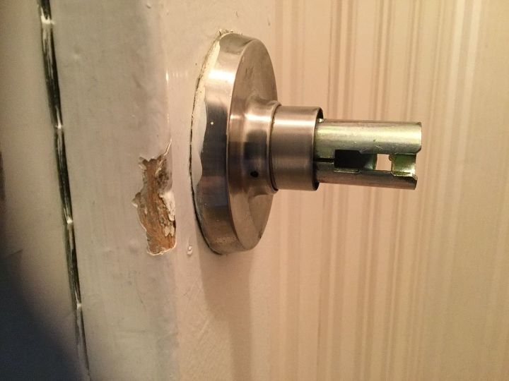 q how to remove this door handle, doors, how to, This is the handle with the knob removed on one side There might be a screw at the base but there is only a small hole visible in the picture Nothing on the other side