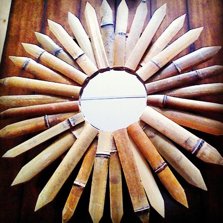 espelho sunburst de madeira flutuante