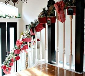 s 25 advent calendar ideas that are so cute, This stairwell garland one with mini boxes