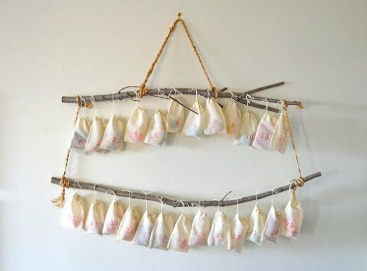 s 25 advent calendar ideas that are so cute, This one hanging from two branches