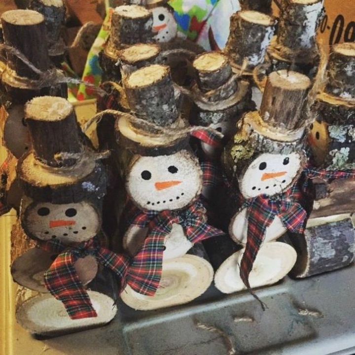 s 13 surprising ways to make a snowman for your porch, Cut some spare logs and draw on them