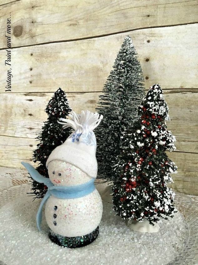 s 13 surprising ways to make a snowman for your porch, Sprinkle some glitter on wooden lathes