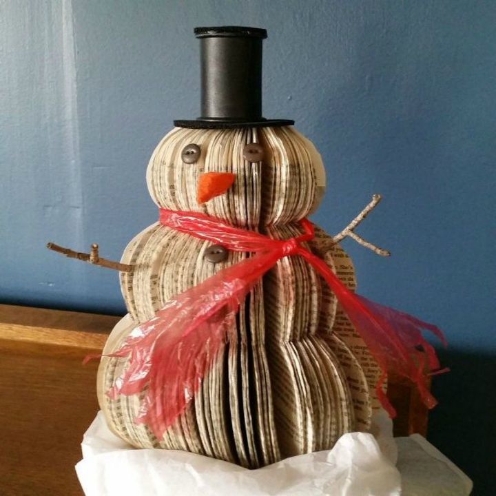 s 13 surprising ways to make a snowman for your porch, Cut up an old book