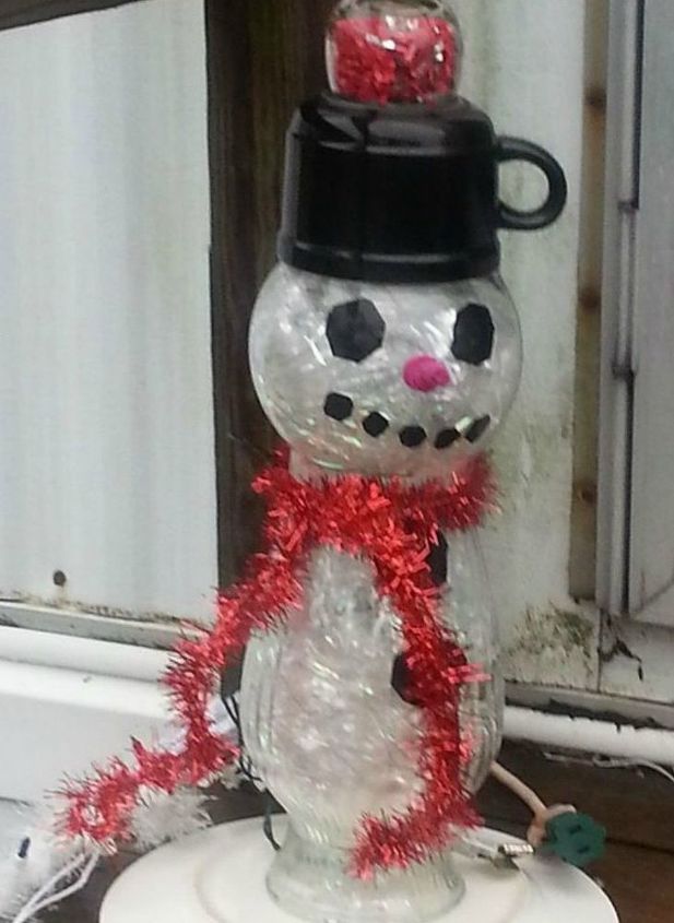 s 13 surprising ways to make a snowman for your porch, Build a glass totem out of repurposed materia