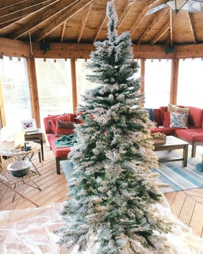 s let it snow with these 12 winter decorating ideas, Flock your Christmas tree for a snowy look