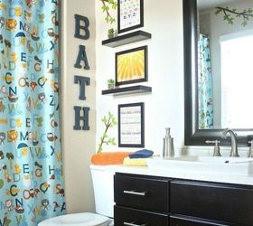 s give your kids the coolest bathroom with these 13 jaw dropping ideas, bathroom ideas, Stick decals on the walls to transport them