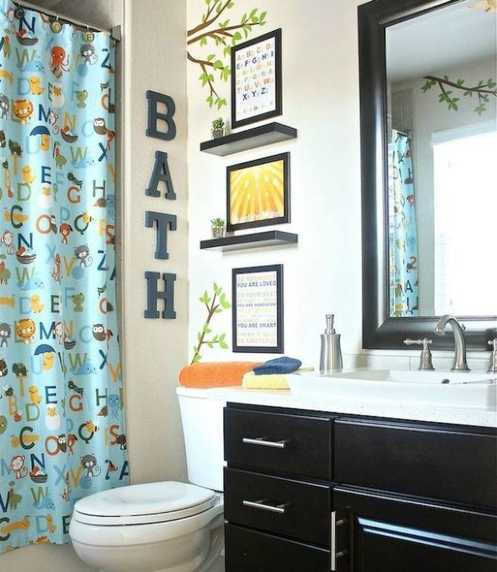 s give your kids the coolest bathroom with these 13 jaw dropping ideas, bathroom ideas, Stick decals on the walls to transport them