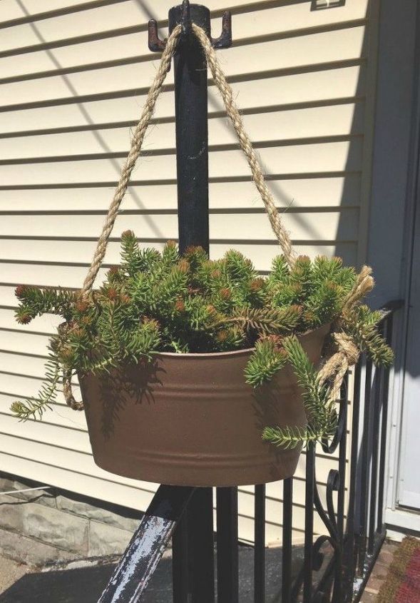 transform your cheap planters with these 15 stunning ideas, Spray paint it to look like galvanized metal