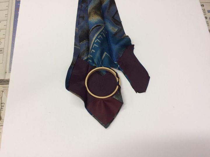 repurpose ugly neckties into beautiful christmas ornaments, christmas decorations, seasonal holiday decor, Encase the fabric in the hoop